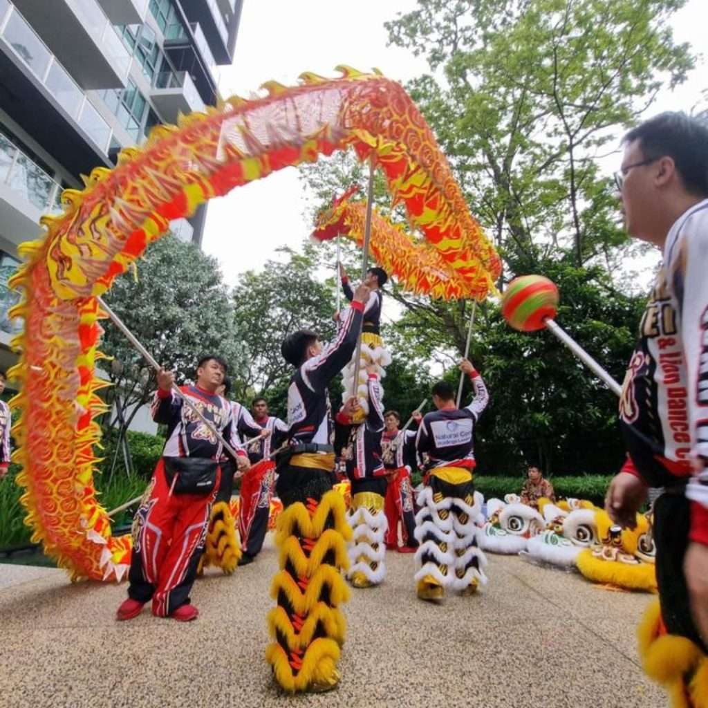 Dragon dance troupe performing outdoors in Singapore