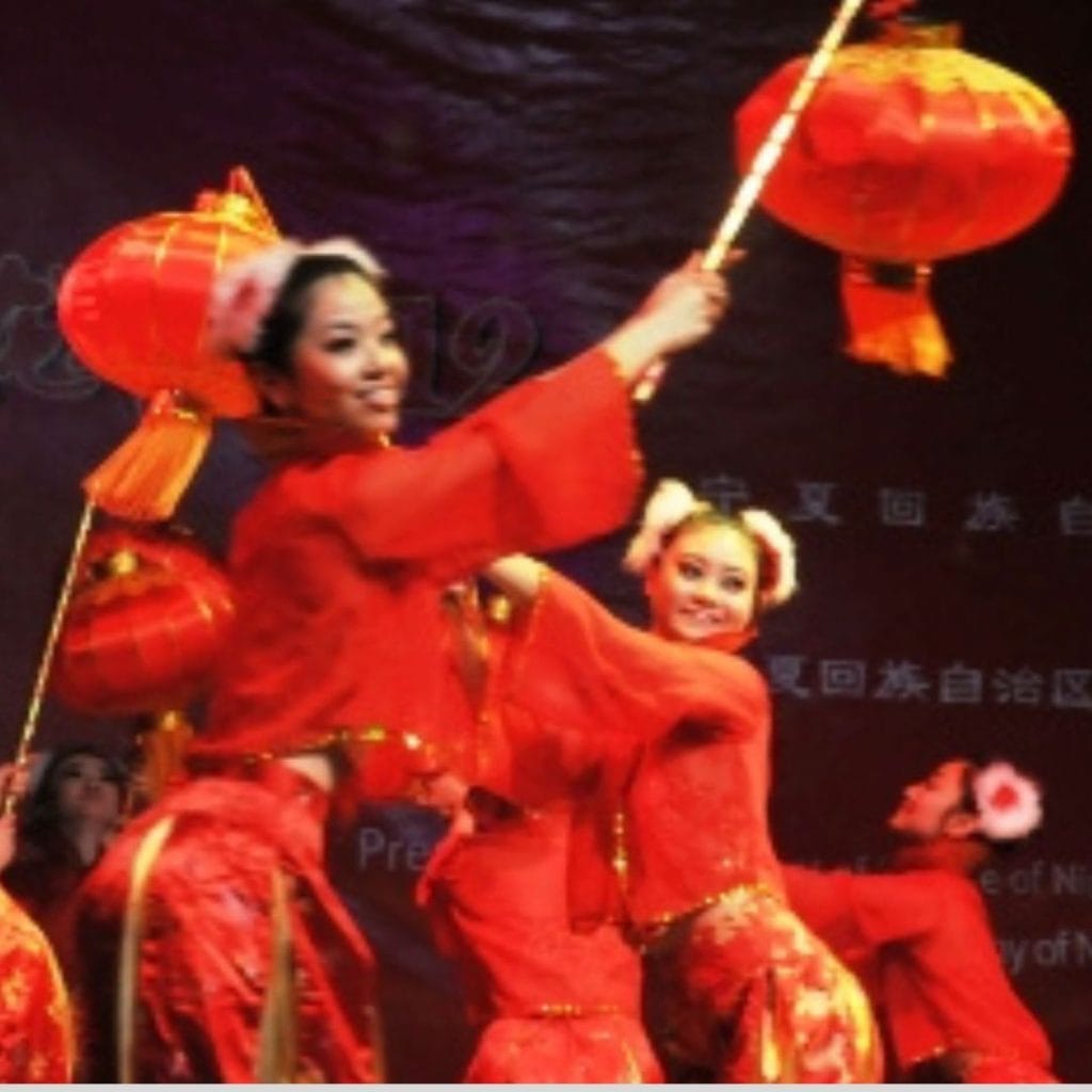 Chinese lantern dancers performing in traditional red costumes