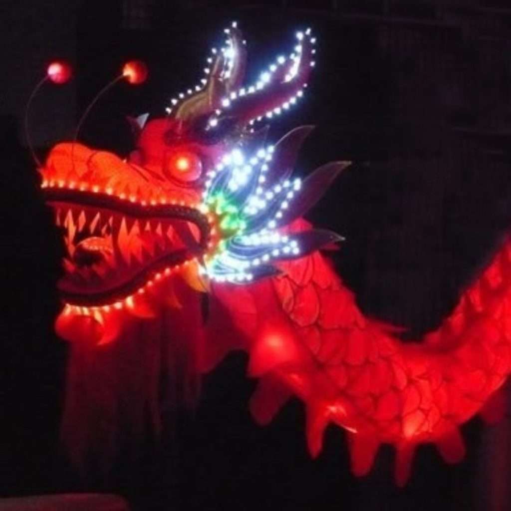 LED dragon with glowing lights performing at event in Singapore